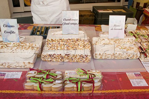 Blocks of nougat on sale at the Sunday market in LIslesurlaSorgue Vaucluse Provence France