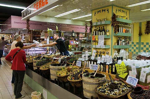 Olive and olive oil stall at the indoor market Avignon Vaucluse Provence France