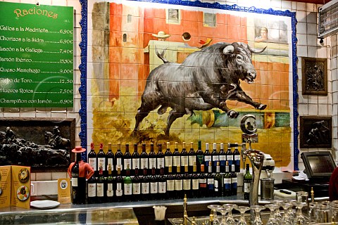 Tile mural of bull behind the bar in La Taurina restaurant Madrid Spain