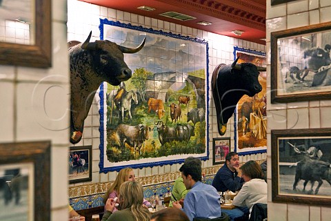 Tile mural of bulls and bulls heads in La Taurina restaurant Madrid Spain