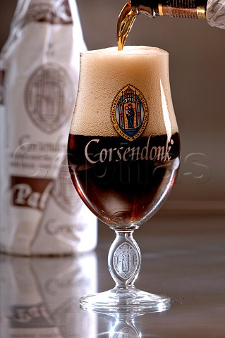 Pouring glass of Corsendonk Belgian beer
