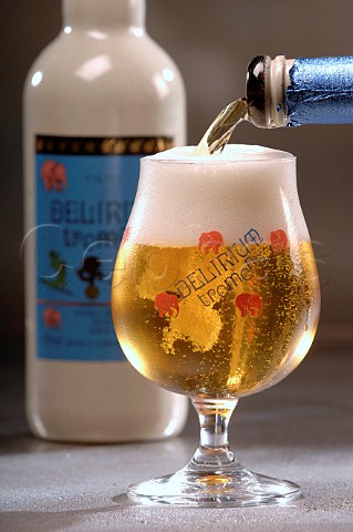 Pouring glass of Delirum Tremens Belgian beer