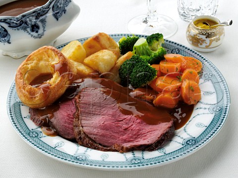Slices of silverside roast beef dinner in a table setting