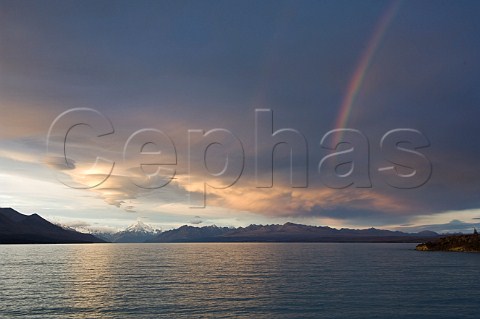 Clouds and rainbow over Mt Cook and Lake Pukaki South Island New Zealand