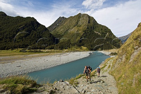 Hikers in West Matukituki River valley Mt Aspiring National Park South Island New Zealand