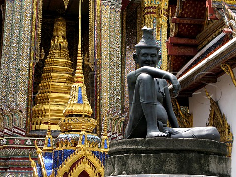 Statue and gilded decorations at Wat Phra Kaeo temple Bangkok Thailand
