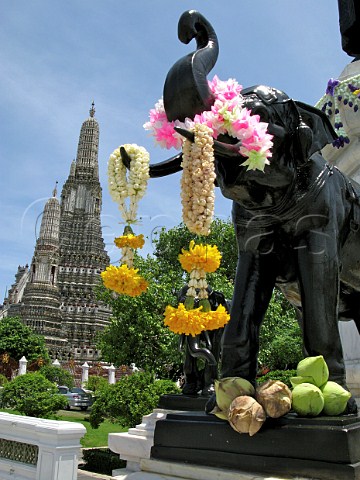 Elephant statue with flower garlands Wat Arun temple Bangkok Thailand