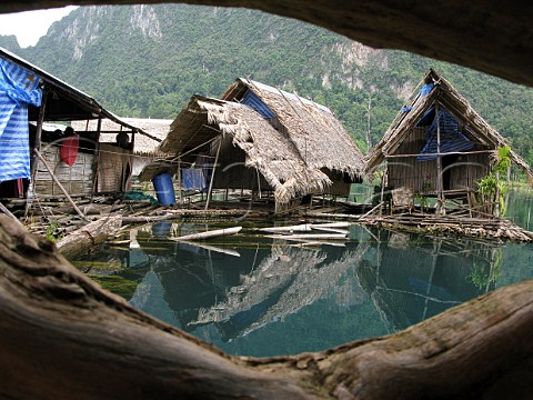 Village huts by river Northern Thailand