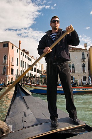 Gondolier on a traghetto ferry on the Grand Canal Venice Italy