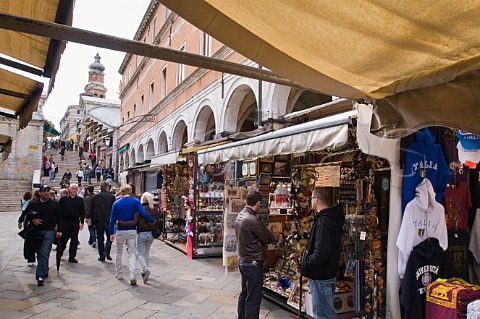 Souvenier stalls lining the street leading to Rialto Bridge San Polo Venice Italy
