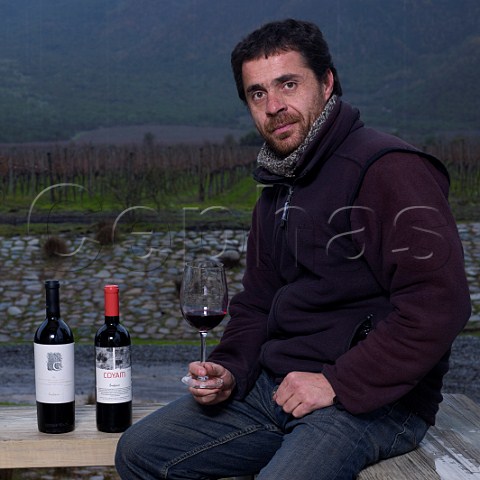 Antonio Bravo winemaker of Emiliana with bottles of his G and Coyam wines  Colchagua Valley Chile