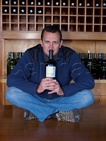 Arnaud Hereu winemaker of Odfjell with bottle of his Carignan made from old vines Maule Chile