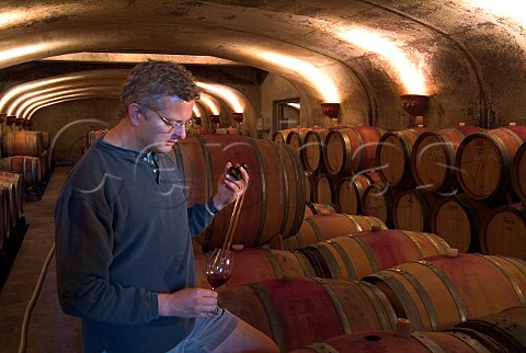 Winemaker Dave Paige tasting Pinot Noir from barrel in cellar of Adelsheim winery  Newberg Oregon USA  Willamette Valley