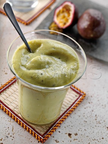 Glass of avocado passion fruit smoothie