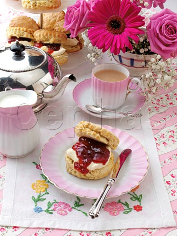 Scones with jam and clotted cream with tea set