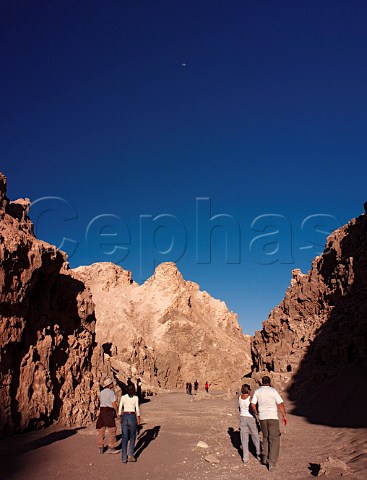 Tourists walking through the Valley of the Moon near San Pedro de Atacama in the Atacama Desert Chile
