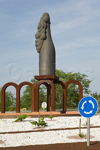 Sculpture of overflowing Cava bottle on roundabout near Sant Sadurni d Anoia Catalunya Spain  Penedes