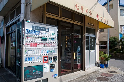 Cigarette vending machine outside a small tobacconist shop  Oita Kyushu Japan