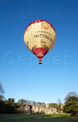 Launching the Taittinger hotair balloon in the grounds of Bibury Court Hotel Gloucestershire England