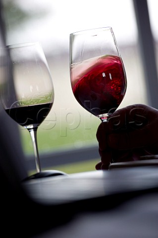 Swirling wine in glass En Primeur tasting of the 2009 vintage at Chteau Marquis de Terme Margaux   Bordeaux France