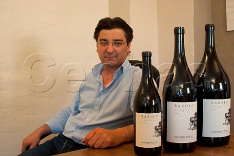 Davide Rosso winemaker of Giovanni Rosso with bottles of his 2004 Cerretta Barolo  Serralunga dAlba Piemonte Italy Barolo