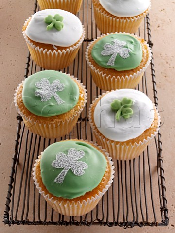Cupcakes with a green shamrock on top of the white icing