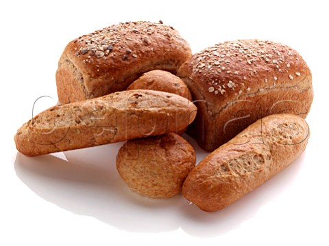 Loaves of bread and rolls on a white background