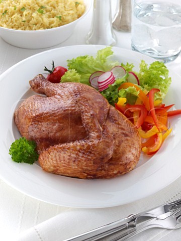 BBQ chicken with salad in a table setting
