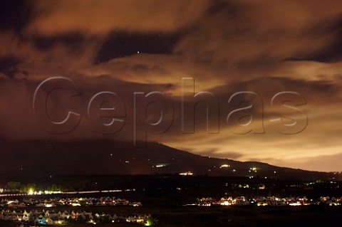 Cloudy night sky over Stellenbosch and the Helderberg mountain Western Cape South Africa