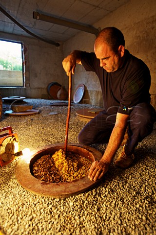 Jean Michel Morel with his buried 3000litre terracotta amphorae in which he  ferments his Rebula  Kabaj Morel Slovrenc near Dobrovo Slovenia   Brda