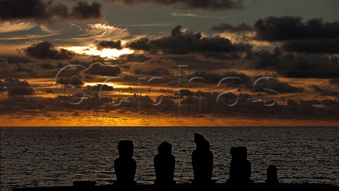 Sunset over the Pacific Ocean with Moais at the Tahai ceremonial complex near Hanga Roa Easter Island