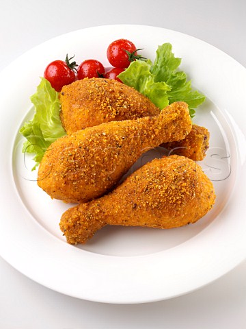Breaded drumsticks with salad