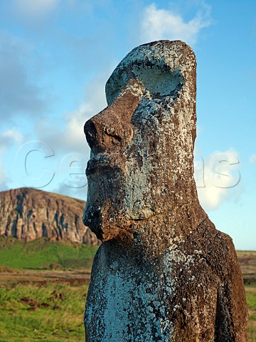 Moai at entrance to Ahu Tongariki with Rano Raraku volcano in the distance Easter Island