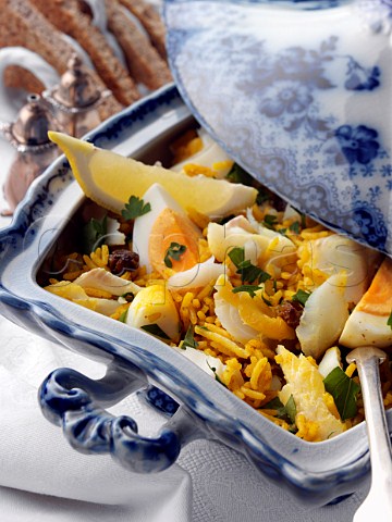 Serving dish of kedgeree with toast
