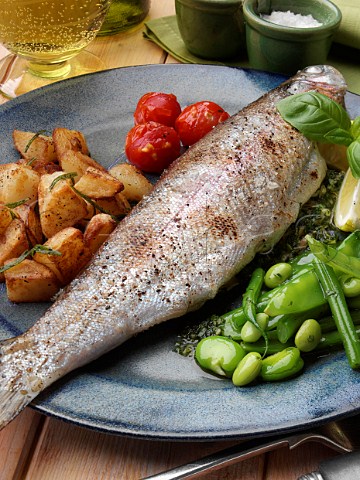 Broiled rainbow trout and sautee potatoes tomatoes and green bean salad