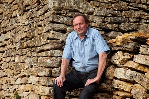 Bruno Clair sitting on a wall of limestone the stones for which were dug from his Vaudenelles vineyard Domaine Bruno Clair MarsannaylaCte CtedOr France  Marsannay
