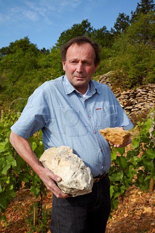 Bruno Clair with limestone of different ages from his Vaudenelles vineyard  The larger piece is younger the other more decomposed Domaine Bruno Clair MarsannaylaCte CtedOr France  Marsannay
