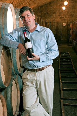 Andres Cabellero winemaker with a bottle of his icon wine Herencia Via Santa Carolina Santiago Chile