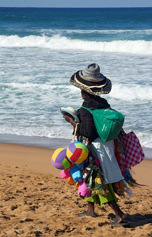 Woman selling goods on the beach at Amanzimtoti KwaZuluNatal South Africa