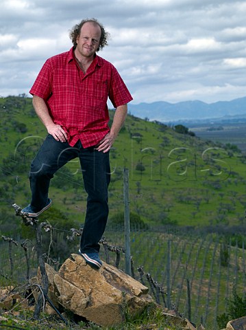 Sven Bruchfeld of Polkura in his Syrah vineyard with a piece of the yellow rock which is known as Polkura in the Mapuche language Marchigue Colchagua Valley Chile