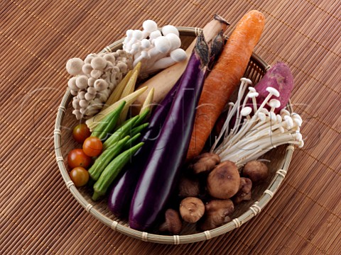 A basket of raw fresh vegetables ingredients