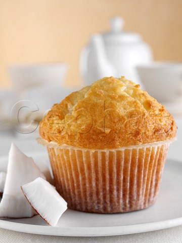 Breakfast coconut muffin with coconut pieces and tea set