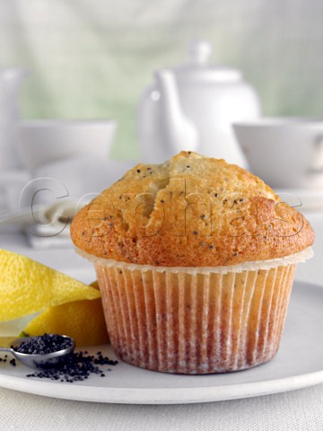 Breakfast lemon and poppy seed muffin with leon wedges and tea set