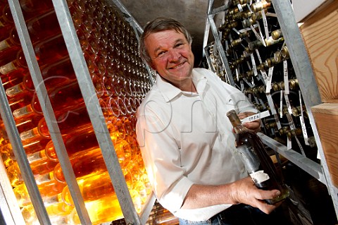 Xavier Planty with bottle of 1922 in cellar of Chteau Guiraud Sauternes Gironde France  Sauternes  Bordeaux