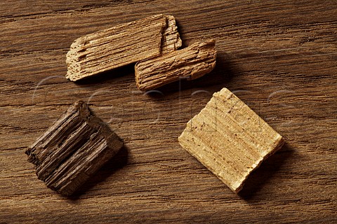Oak chips of different toast levels for imparting oak characteristics to inexpensive wine where the cost of new oak barrels would be prohibitive