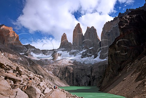 Granite pillars tower above a lake in the Torres Del Paine National Park Patagonia Chile
