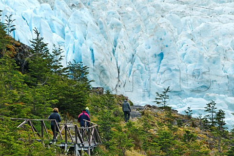 Trekkers approaching the Serrano Glacier in the Torres del Paine National Park Patagonia Chile