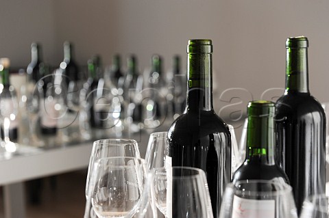 Bottles and glasses at a tasting of Chatonnet Bordeaux wines France