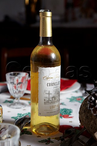 Bottle of 2009 Chteau Cornelien Loupiac on Christmas dining table France