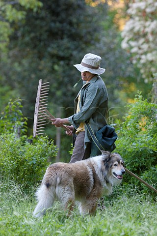 Young farmer with his dog Tuscany Italy
